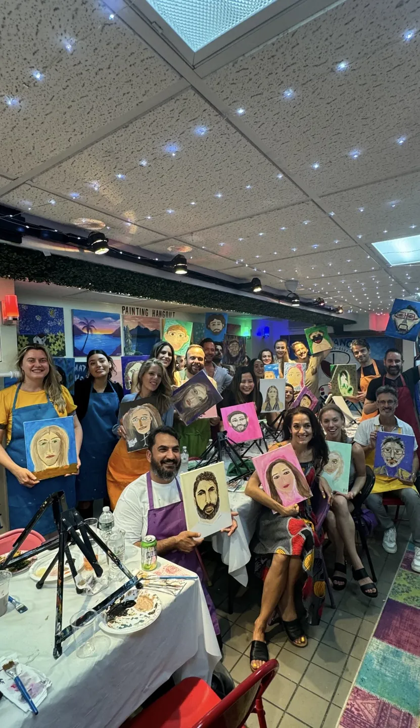 A group showing the portraits they painted together